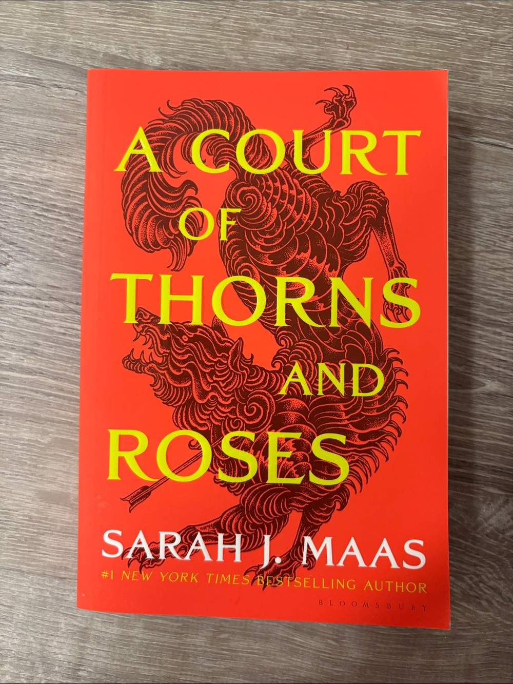 A Court of Thorns and Roses by Sarah J. Maas - Bright Orange Paperback